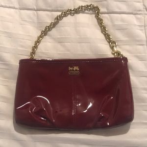 Maroon and gold coach bag